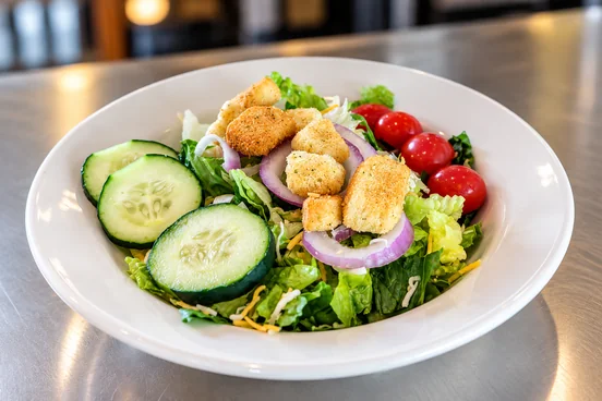 Fresh garden salad from Miller's Tavern with crisp greens, tomatoes, and croutons.